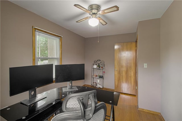 4511 NE 45th St, Kansas City, MO 64117 - home office featuring ceiling fan and wood finished floors