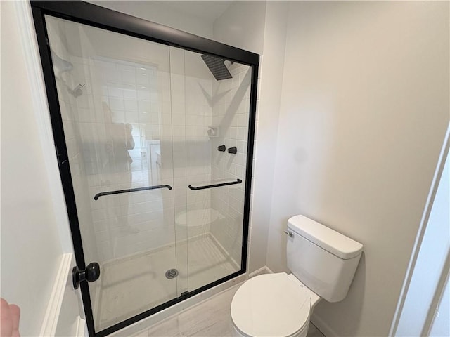 3647 NW Blue Jacket Dr, Lees Summit, MO 64064 - bathroom featuring toilet and a stall shower