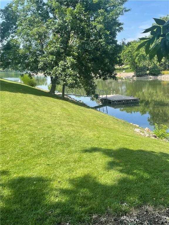 3647 NW Blue Jacket Dr, Lees Summit, MO 64064 - view of grassy yard with a water view and a floating dock