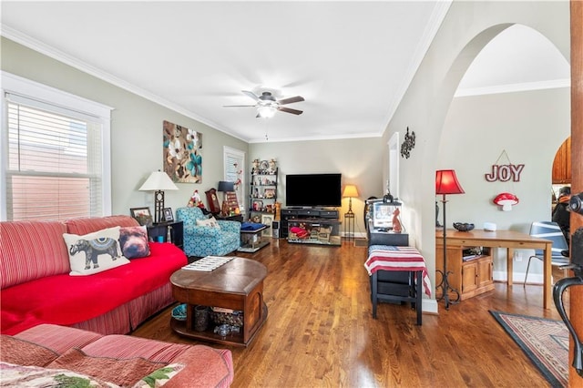 808 N River Blvd, Independence, MO 64050 - living room with a ceiling fan, wood finished floors, crown molding, arched walkways, and baseboards