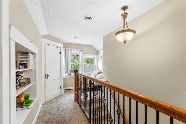 808 N River Blvd, Independence, MO 64050 - hall with carpet flooring, an upstairs landing, a textured ceiling, baseboards, and lofted ceiling