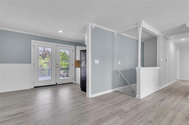 7314 NW 84th Ter, Kansas City, MO 64153 - empty room with ornamental molding, wood finished floors, french doors, a textured ceiling, and recessed lighting