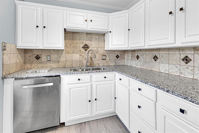 7314 NW 84th Ter, Kansas City, MO 64153 - kitchen featuring dishwasher, a sink, white cabinets, light stone counters, and crown molding
