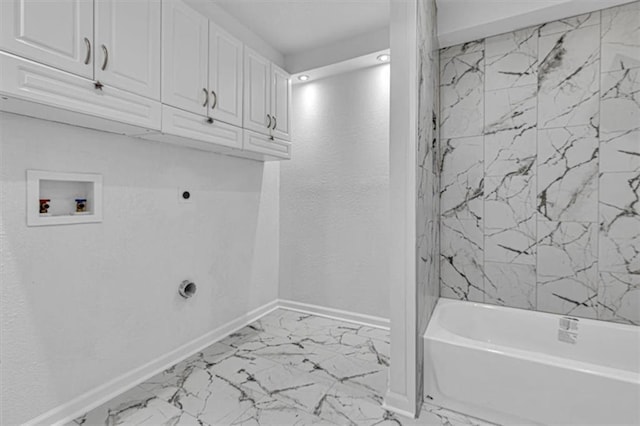 7314 NW 84th Ter, Kansas City, MO 64153 - laundry room with hookup for an electric dryer, cabinet space, baseboards, washer hookup, and marble look tiles