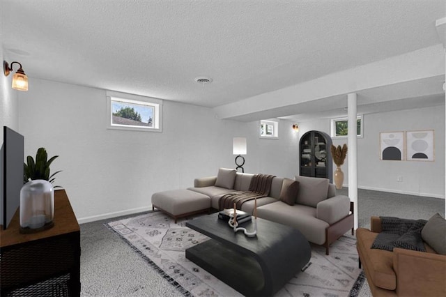 7314 NW 84th Ter, Kansas City, MO 64153 - living room with a textured ceiling, plenty of natural light, light carpet, and baseboards