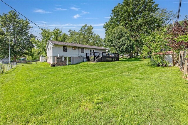 7314 NW 84th Ter, Kansas City, MO 64153 - view of yard featuring a deck and stairway