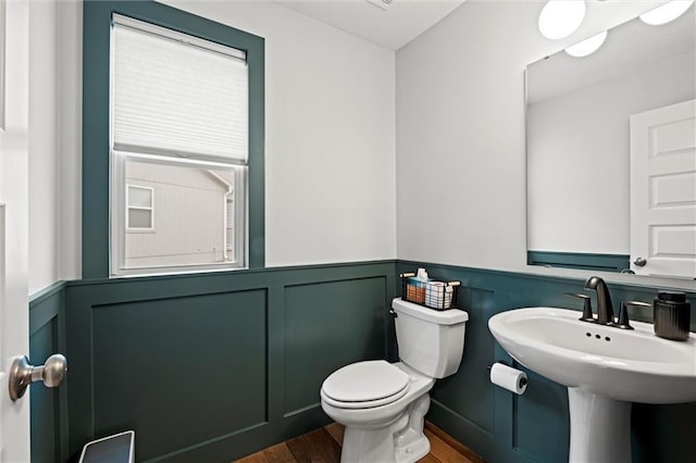 8810 SW 9th Ter, Blue Springs, MO 64064 - bathroom featuring wood finished floors and wainscoting