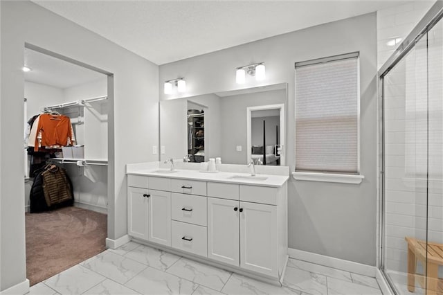8810 SW 9th Ter, Blue Springs, MO 64064 - full bathroom with marble finish floors, a spacious closet, double vanity, and an enclosed shower