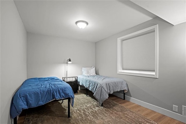8810 SW 9th Ter, Blue Springs, MO 64064 - bedroom featuring wood finished floors and baseboards