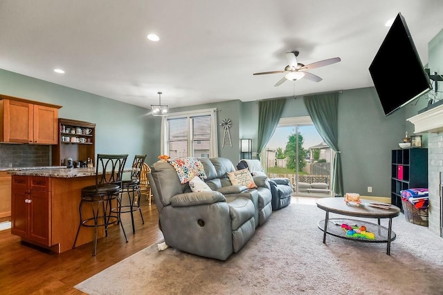 28340 W 164th St, Gardner, KS 66030 - living room with ceiling fan, wood finished floors, recessed lighting, and a fireplace