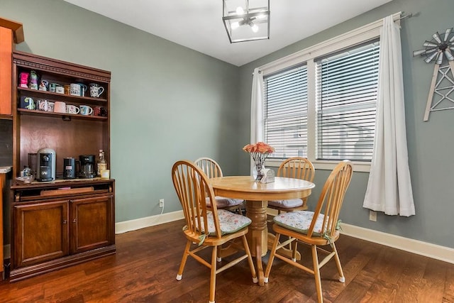 28340 W 164th St, Gardner, KS 66030 - dining space featuring baseboards, dark wood finished floors, and a chandelier