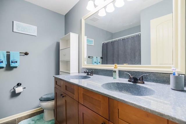 28340 W 164th St, Gardner, KS 66030 - bathroom with toilet, double vanity, baseboards, tile patterned flooring, and curtained shower