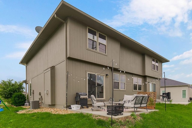 28340 W 164th St, Gardner, KS 66030 - rear view of house with a patio, a lawn, and central AC