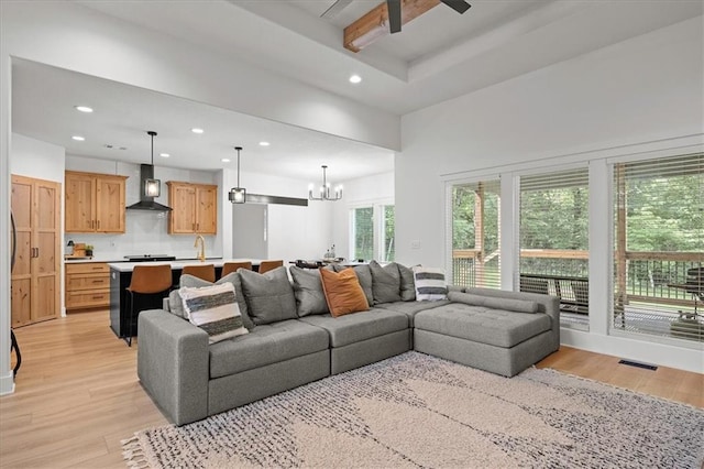 306 SW 17th St, Oak Grove, MO 64075 - living area featuring light wood-type flooring, recessed lighting, and a chandelier