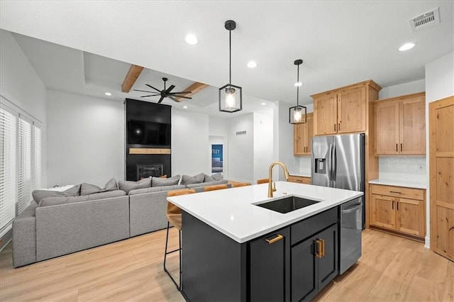 306 SW 17th St, Oak Grove, MO 64075 - kitchen featuring appliances with stainless steel finishes, light wood finished floors, a ceiling fan, light countertops, and recessed lighting