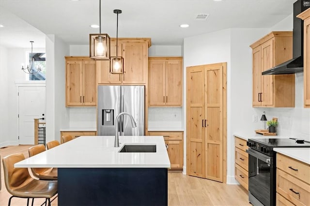 306 SW 17th St, Oak Grove, MO 64075 - kitchen with light brown cabinetry, black range with electric cooktop, wall chimney range hood, and recessed lighting