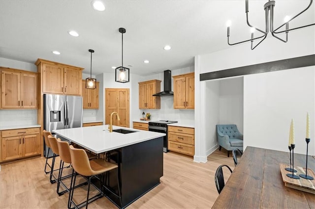306 SW 17th St, Oak Grove, MO 64075 - kitchen featuring black electric range, wall chimney exhaust hood, light wood finished floors, recessed lighting, and light countertops