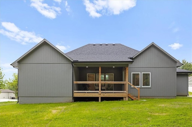 306 SW 17th St, Oak Grove, MO 64075 - rear view of house featuring a lawn, a shingled roof, and a deck