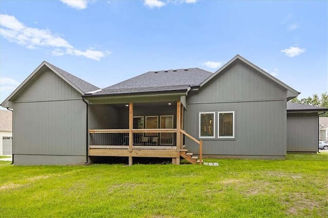 306 SW 17th St, Oak Grove, MO 64075 - back of property with a lawn, roof with shingles, and a sunroom