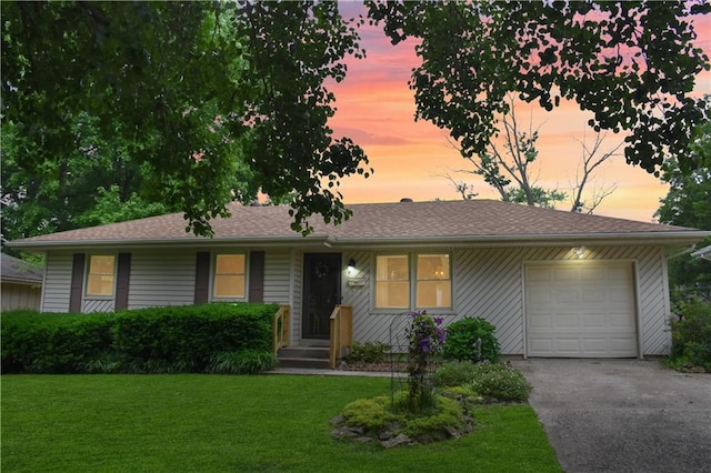 13408 Winchester Ave, Grandview, MO 64030 - ranch-style home featuring driveway, a yard, and a garage