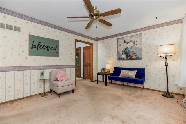 13408 Winchester Ave, Grandview, MO 64030 - living area with carpet, a ceiling fan, wallpapered walls, and ornamental molding