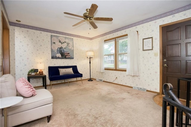 13408 Winchester Ave, Grandview, MO 64030 - living area featuring wallpapered walls, a ceiling fan, carpet, and ornamental molding