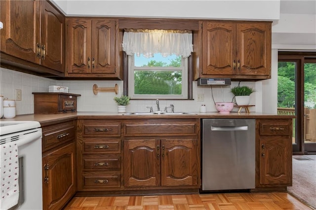 13408 Winchester Ave, Grandview, MO 64030 - kitchen featuring dishwasher, a sink, white electric range oven, tasteful backsplash, and light countertops