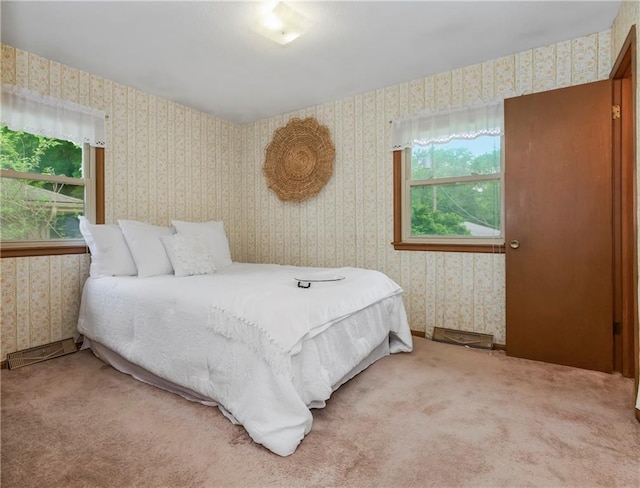 13408 Winchester Ave, Grandview, MO 64030 - bedroom featuring wallpapered walls, multiple windows, and carpet
