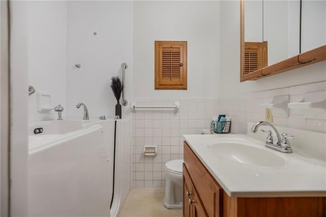 13408 Winchester Ave, Grandview, MO 64030 - full bath with vanity, tile walls, toilet, and wainscoting
