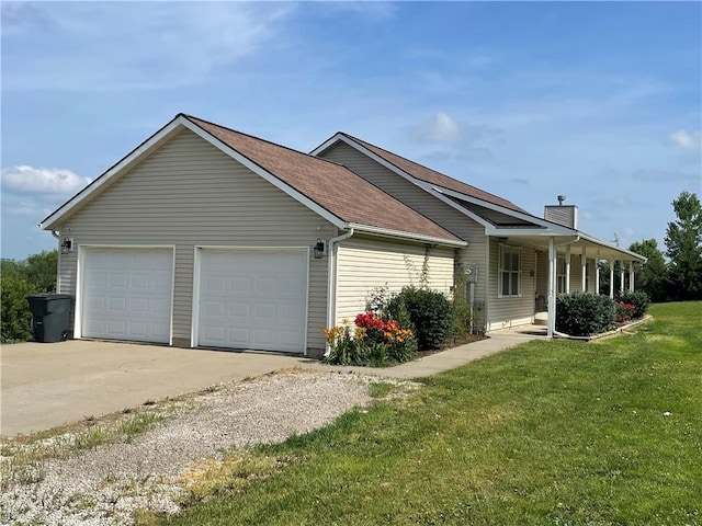 31821 159th St, Leavenworth, KS 66048 - view of home's exterior featuring a garage, a yard, driveway, a chimney, and roof with shingles