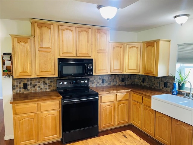 31821 159th St, Leavenworth, KS 66048 - kitchen featuring black appliances, light wood finished floors, light brown cabinetry, decorative backsplash, and wood counters