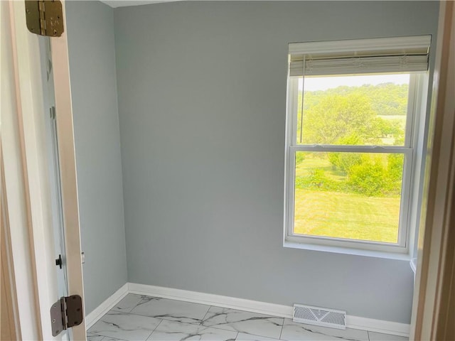 31821 159th St, Leavenworth, KS 66048 - spare room featuring baseboards and marble finish flooring