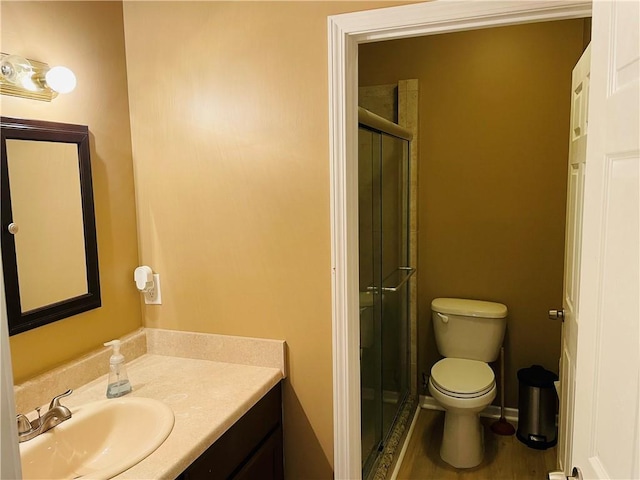 31821 159th St, Leavenworth, KS 66048 - bathroom featuring vanity, a stall shower, and wood finished floors