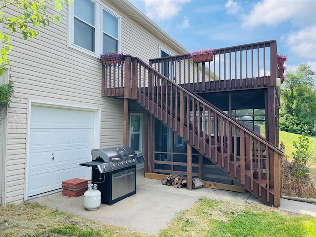 31821 159th St, Leavenworth, KS 66048 - rear view of property featuring a wooden deck, stairway, and a garage