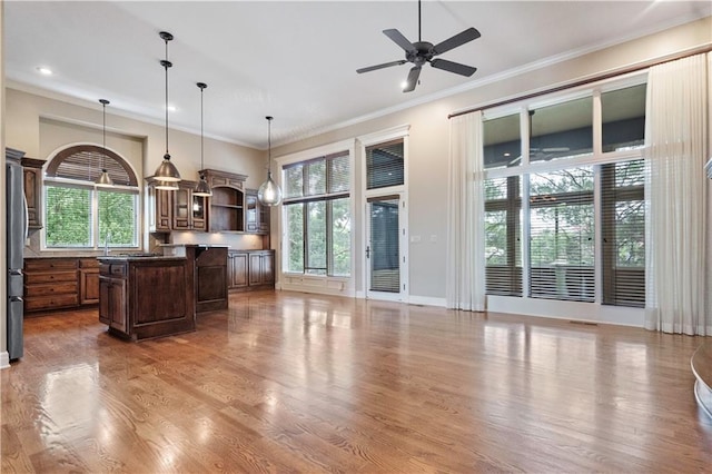 15027 Ash St, Leawood, KS 66224 - kitchen featuring open shelves, healthy amount of natural light, wood finished floors, ornamental molding, and recessed lighting