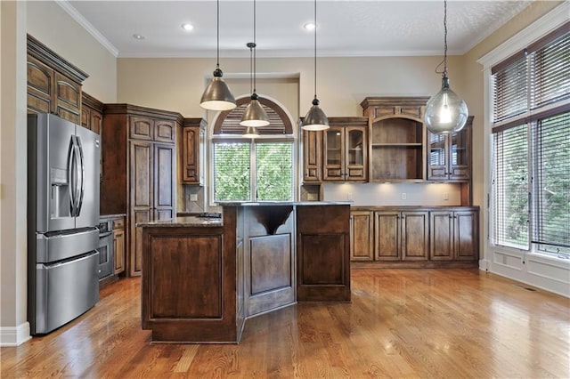 15027 Ash St, Leawood, KS 66224 - kitchen with stainless steel fridge, a center island, dark wood finished floors, glass insert cabinets, and open shelves