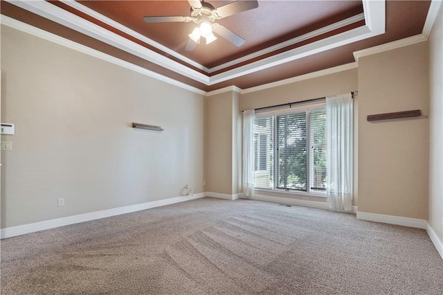 15027 Ash St, Leawood, KS 66224 - empty room featuring a tray ceiling, ornamental molding, carpet floors, and ceiling fan