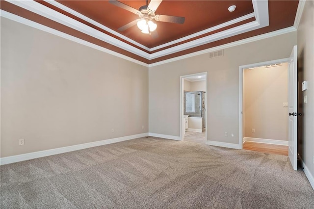 15027 Ash St, Leawood, KS 66224 - spare room featuring a raised ceiling, ornamental molding, light colored carpet, and ceiling fan