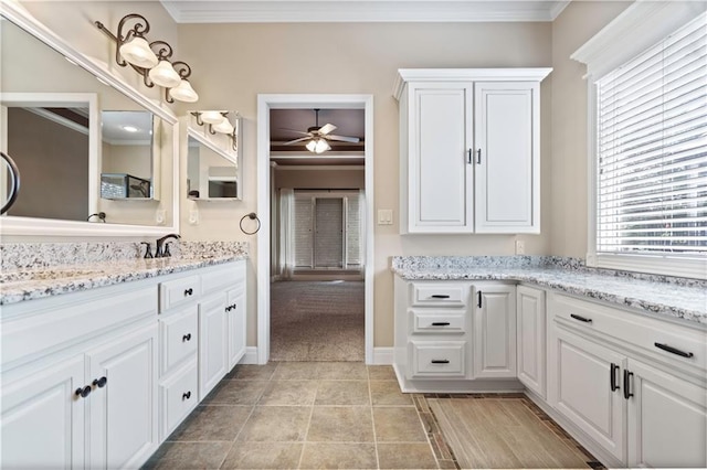 15027 Ash St, Leawood, KS 66224 - bathroom featuring crown molding, a ceiling fan, and vanity