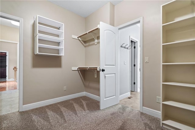 15027 Ash St, Leawood, KS 66224 - walk in closet featuring carpet floors