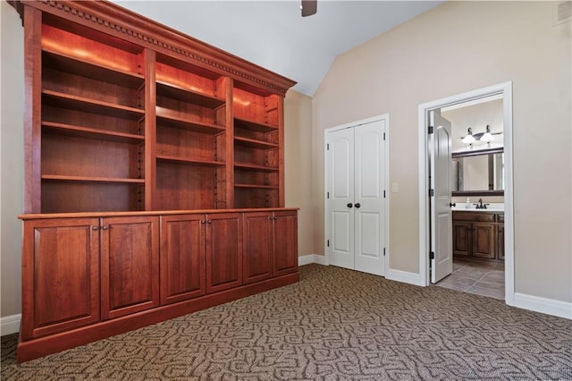 15027 Ash St, Leawood, KS 66224 - unfurnished bedroom featuring carpet, lofted ceiling, ensuite bathroom, and ceiling fan