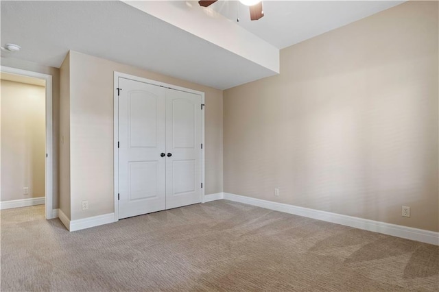 15027 Ash St, Leawood, KS 66224 - unfurnished bedroom with carpet, a closet, and a ceiling fan