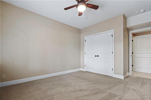 15027 Ash St, Leawood, KS 66224 - unfurnished bedroom with carpet floors, a closet, and a ceiling fan
