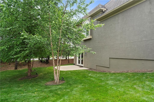 15027 Ash St, Leawood, KS 66224 - view of green lawn with a patio area