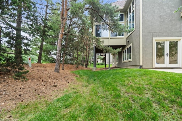 15027 Ash St, Leawood, KS 66224 - view of grassy yard featuring french doors