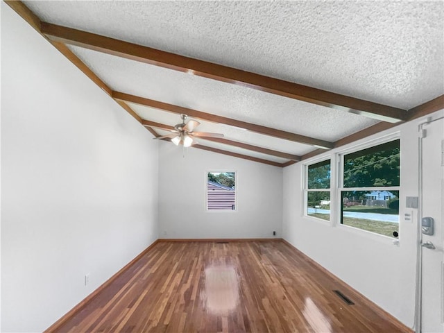 2939 Jewett St, Kansas City, MO 64117 - unfurnished room featuring a textured ceiling, wood finished floors, and ceiling fan