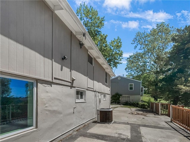 2939 Jewett St, Kansas City, MO 64117 - view of side of property featuring cooling unit and a patio area