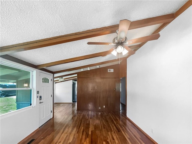 2939 Jewett St, Kansas City, MO 64117 - spare room with a textured ceiling, wood finished floors, ceiling fan, beamed ceiling, and baseboards