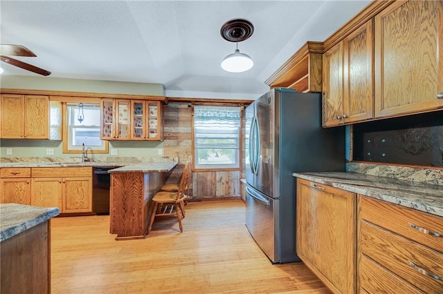 160 SW 131st Hwy, Holden, MO 64040 - kitchen with dishwasher, light wood finished floors, freestanding refrigerator, a ceiling fan, and glass insert cabinets