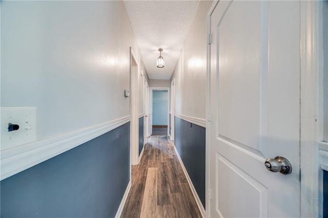 160 SW 131st Hwy, Holden, MO 64040 - hallway with a textured ceiling and dark wood finished floors